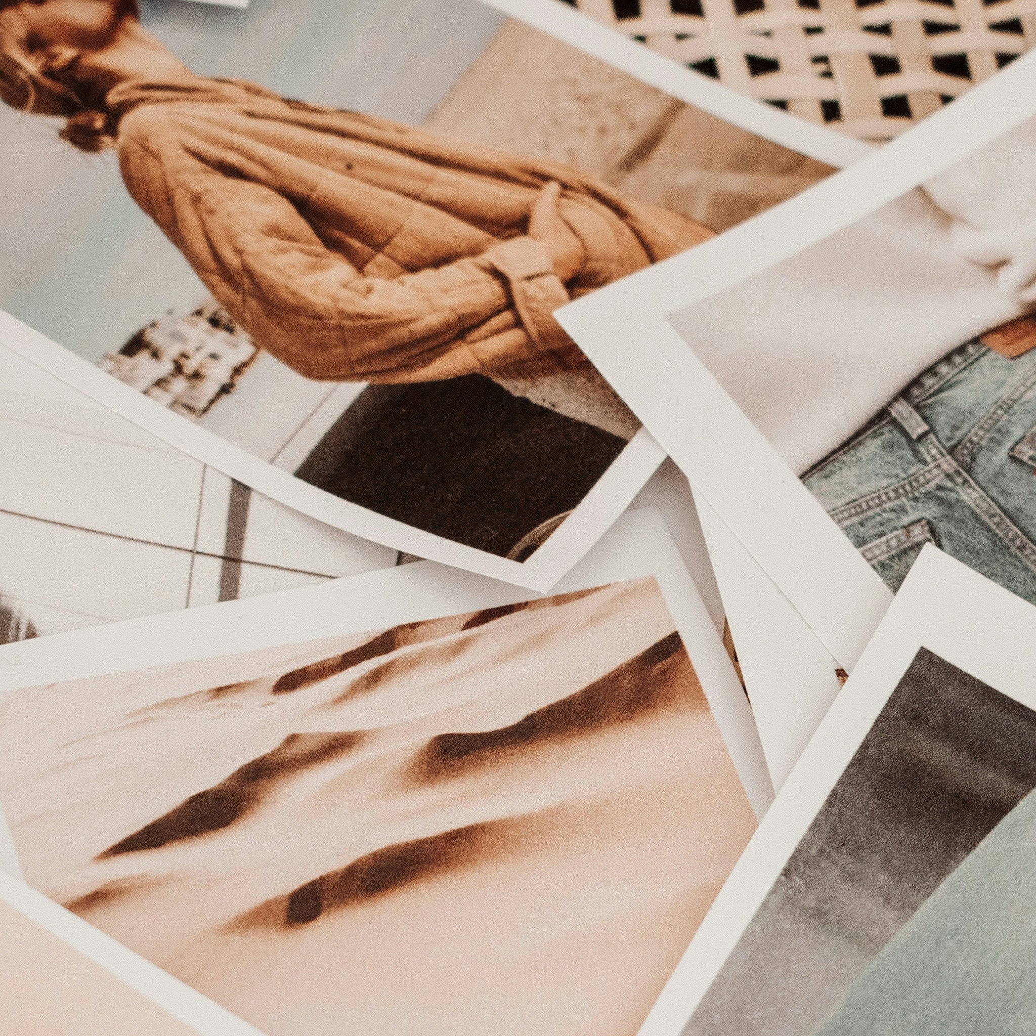 Collection of Polaroid-style photos on a woven surface