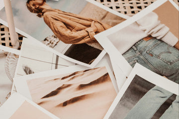 Collection of Polaroid-style photos on a woven surface